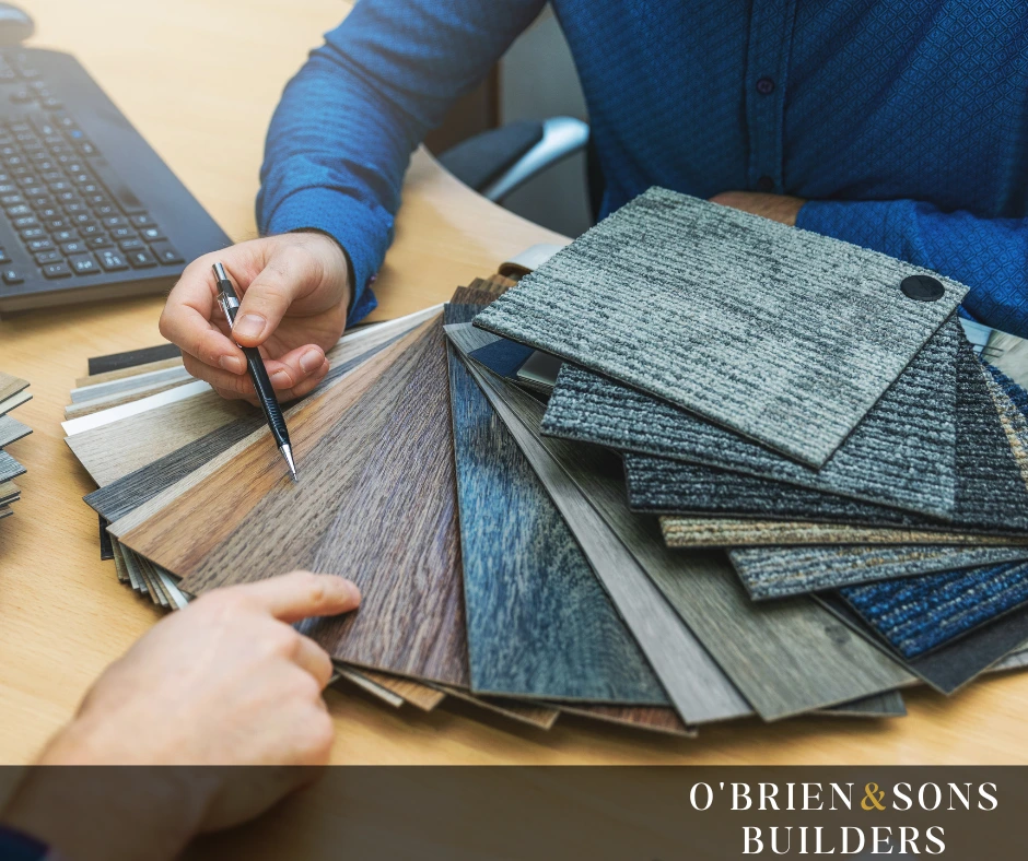 "Contractor or homeowner evaluating various flooring planks to determine the best material quality for floor installation."